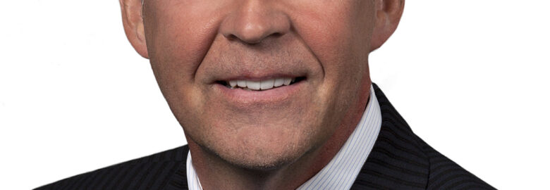 Howard E. MacKichan , KC